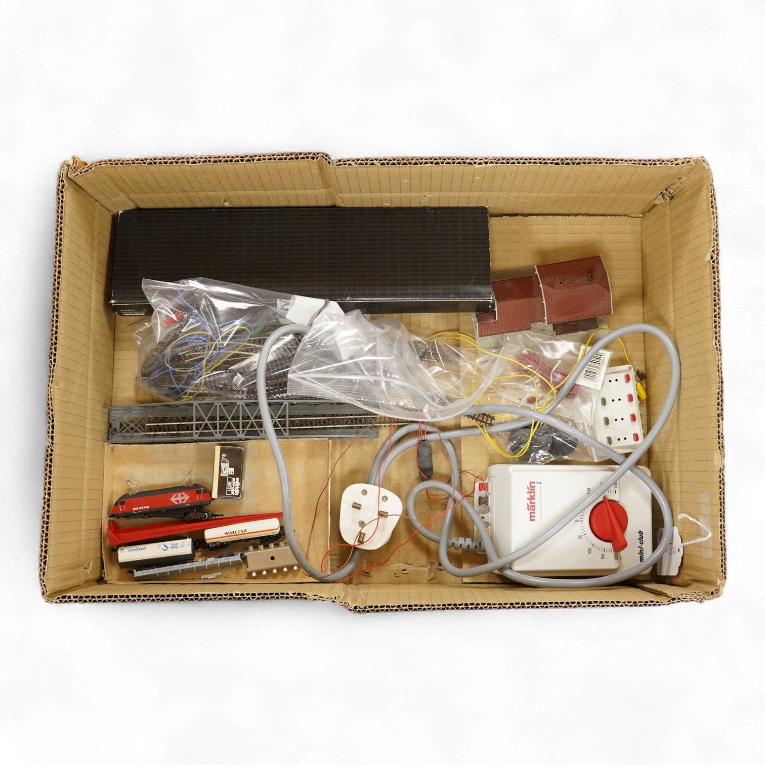 A Marklin Z gauge railway collection, Swiss railway from set 81852, including an SBB CFF FFS Bo-Bo pantograph electric locomotive, together with a boxed Mini-club unpowered 4-car set (87456), three freight wagons, a brid